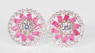 A pair of ladies silver stud earrings of round for