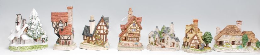 A group of seven David Winter Cottage ornaments to