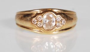 A hallmarked 9ct gold and CZ band ring. The ring h