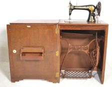 A 1930's Art Deco oak Singer Sewing machine cabine