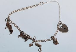A small silver charm bracelet having a total of fo