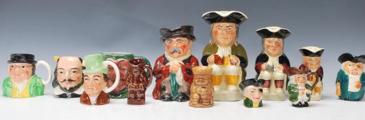 A collection of thirteen 20th Century Toby jugs of