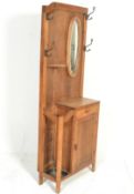 A 1930's Art Deco oak hallstand. The upright back