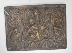 A 20th Century cast brass wall plaque having embos