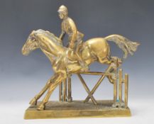 A 20th Century brass statue depicting a horse with