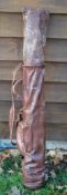 Full leather pencil golf bag with a travel hood, and original leather shoulder strap some scuffing