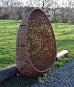 Retro 1970s 'Egg' Wicker Swing Chair with a metal frame and wicker body, two loops to at the top