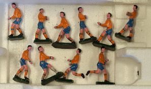 Ten Old Lead Footballers yellow shirts, blue shorts, yellow socks