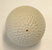 Fine Dunlop 31 bramble pattern rubber core golf ball - with orange spot and makers name to the poles