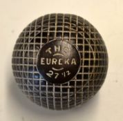 The Eureka 27 1/2 brown mesh guttie golf ball - with the remains of the original paint to the line