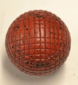Fine Red square pattern guttie golf ball c.1895 - retaining most of the red paint and appears