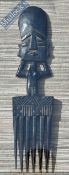 African Wooden Comb - African face having a 6-prong comb mounted in a glazed display frame 46 x