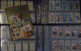 Selection of cigarette cards (2 albums) full of part sets to include Wills and Players with ‘Arms of