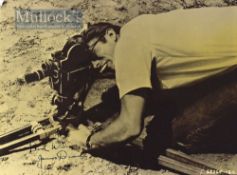 Autograph – James Dean (1931-1955) Signed Photograph depicts Dean looking through a camera,