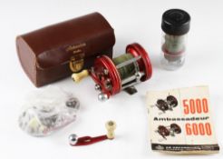 Abu Ambassadeur 6000 level wind multiplier cased: red end plates, with slight rim wear comes in