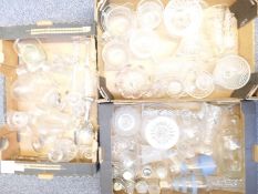 Over 50 pieces of cut glassware including cruet sets, vases, tazas, decanters, goblets etc.