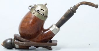 A German burr walnut and pewter pipe with horn mounts, on stand