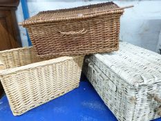 Three vintage wicker hampers and baskets including a lockable military/motoring example, width 76cm