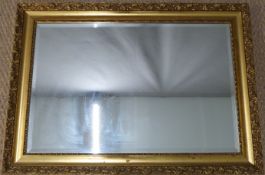 Gilt framed bevelled glass mirror, 89 x 64.5cm overall