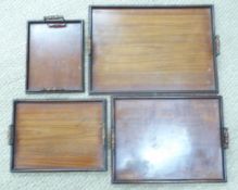 Set of four graduated oak trays, largest 61 x 44cm