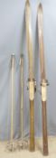 A pair of vintage hardwood skis and poles, the skis with metal edges, length 212cm