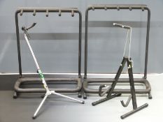 Two guitar stands, each to hold four guitars, together with two single guitar examples, one by TG
