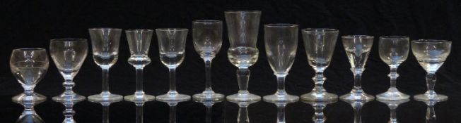 Twelve 19thC and later clear drinking glasses, most with knopped stems, largest 13.5cm tall.