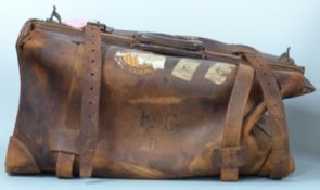 An exceptionally large leather Gladstone bag with brass fittings and Irish Steamship Company labels,