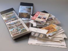 A box of GB coin/stamp covers and presentation packs and first day covers and two albums of modern