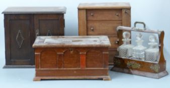 A 19thC apprentice Wellington chest with four drawers, H27 x W24 x D15cm, an oak smoker's cabinet