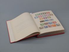 A Stanley Gibbons red crown album of George VI Commonwealth stamps, mainly mint and well filled with