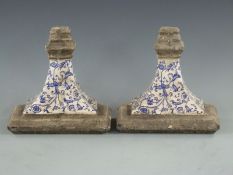 A pair of blue and white stoneware wall plinths, height 23cm, width 24cm