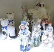 A pair of Staffordshire cats, further Staffordshire and continental figures