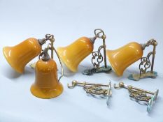 Four designer wall mounted light fittings and a spare bracket, by repute Christopher Wray