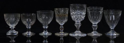 Eight 19thC and later large clear glass goblets, most with cut or engraved decoration, one with gilt