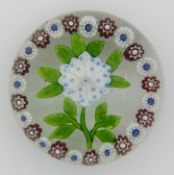 Baccarat glass garlanded flower paperweight decorated with a central blue and white clematis with