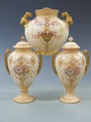 Crown Devon garniture comprising two lidded pedestal vases and a twin handled example