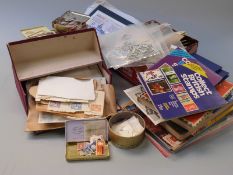 A quantity of loose GB and Commonwealth stamps in packets and tins, together with catalogues and