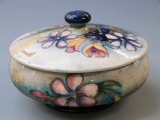 William Moorcroft lidded pedestal powder dish in the Spring Flowers design, impressed and paper