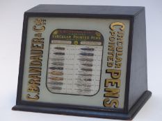 C. Brandauer & Co's Circular Pointed Pens shop diaplay advertising cabinet with nibs behind glazed