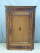 Georgian oak and mahogany corner cupboard with two dummy drawers flanking a single drawer, height