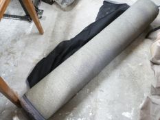 A bolt of black velour fabric with hemmed edges, haberdashery / textiles / upholstery interest width