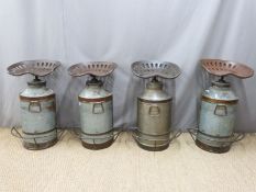A set of four industrial style bar stools made from milk churns and revolving tractor seats with