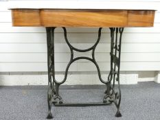 A marble-topped washstand with cast iron sewing machine base, W112cm