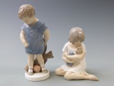 Two Copenhagen figures comprising boy with teddy bear and girl with doll, tallest 18.5cm