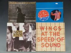 Approximately 30 LPs in a case including The Beatles / Wings etc