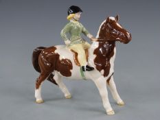 Beswick Girl on a skewbald pony