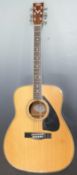 Yamaha FG-440 acoustic guitar fitted with six steel strings and decorative mother of pearl insets to