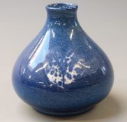 Cobridge stoneware pedestal squat vase with decoration of a moth on a blue ground, 9cm tall