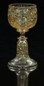 Moser style drinking glass with all over enamelled decoration of flowers on a clear ground, 14cm